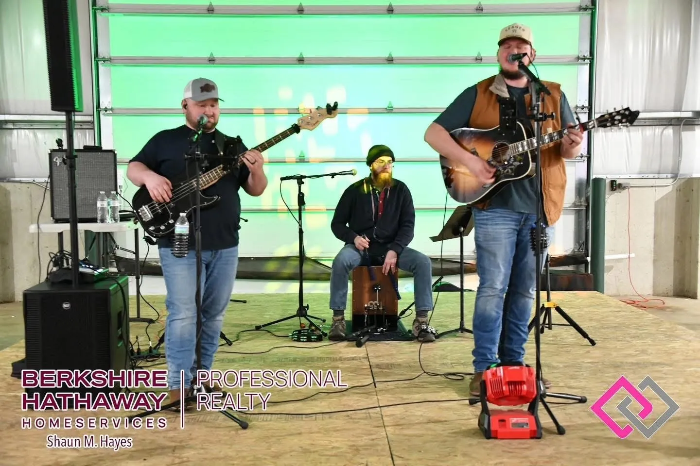 The Isaac Buschur Trio performing on bass, cajón and acoustic guitar